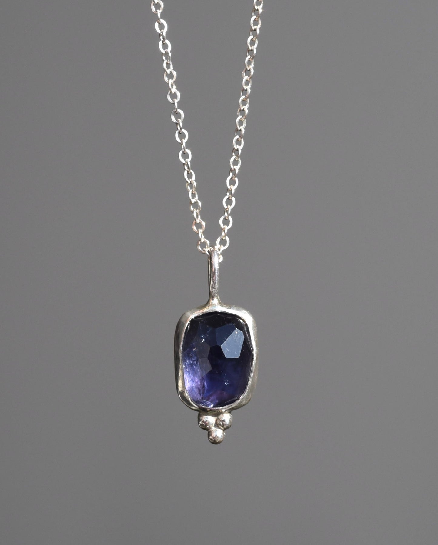 Purple shimmer iolite pendant