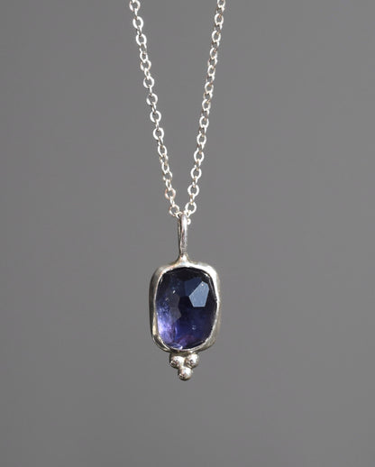 Purple shimmer iolite pendant