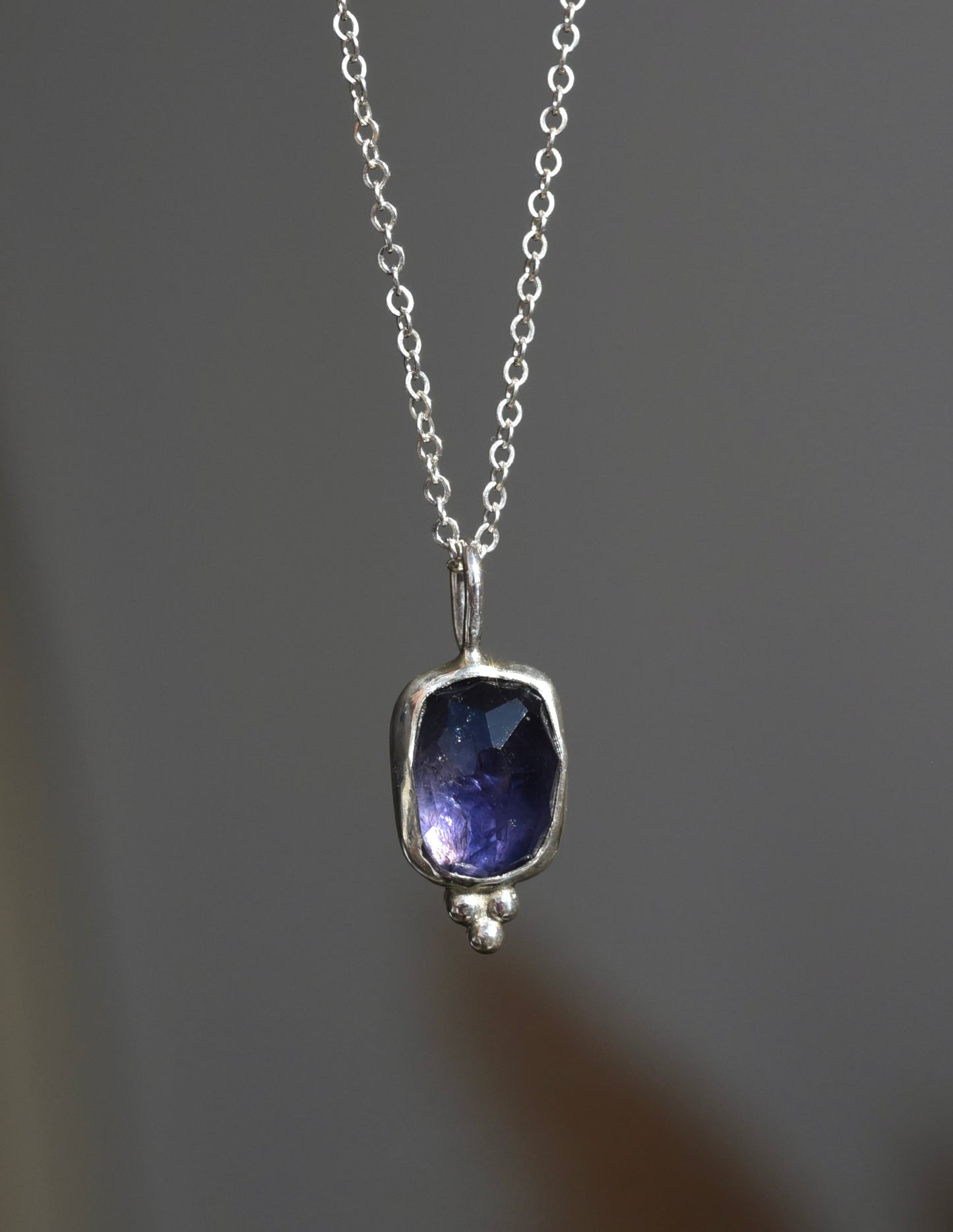 Purple shimmer iolite pendant