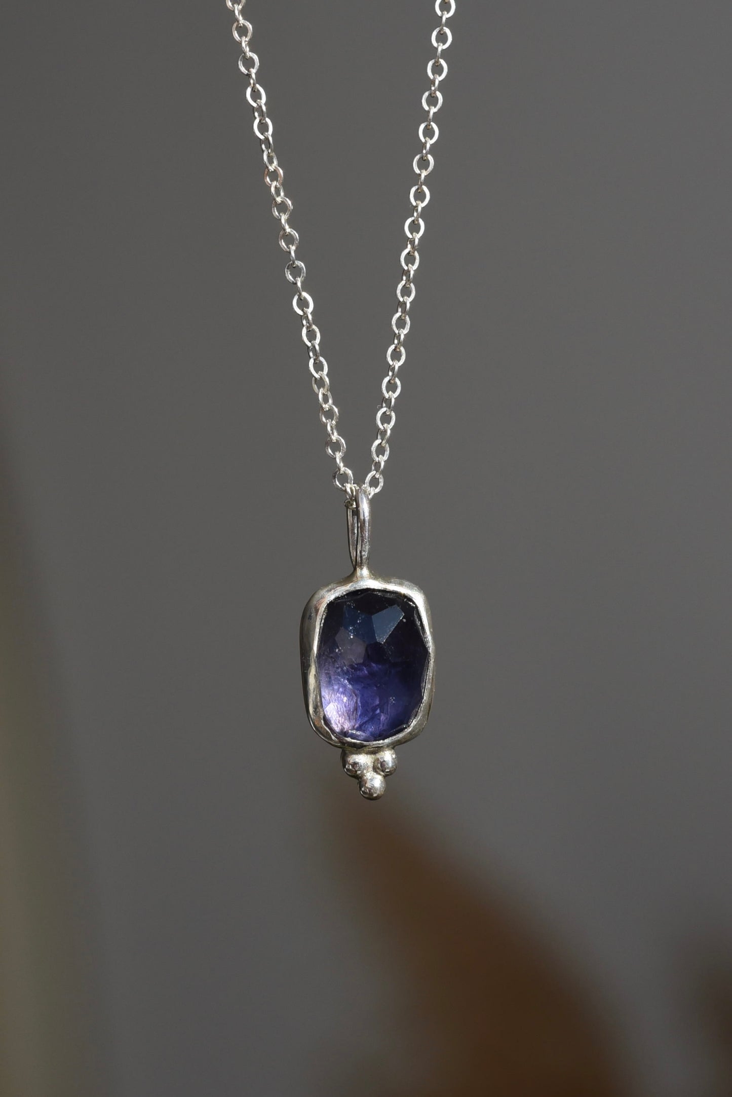 Purple shimmer iolite pendant