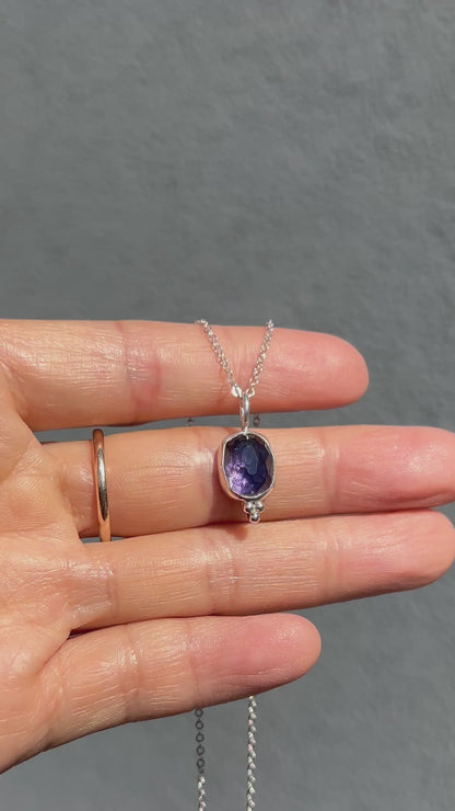 Purple shimmer iolite pendant